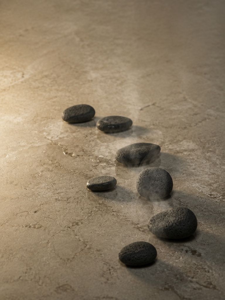Warmed basalt stones on pale limestone