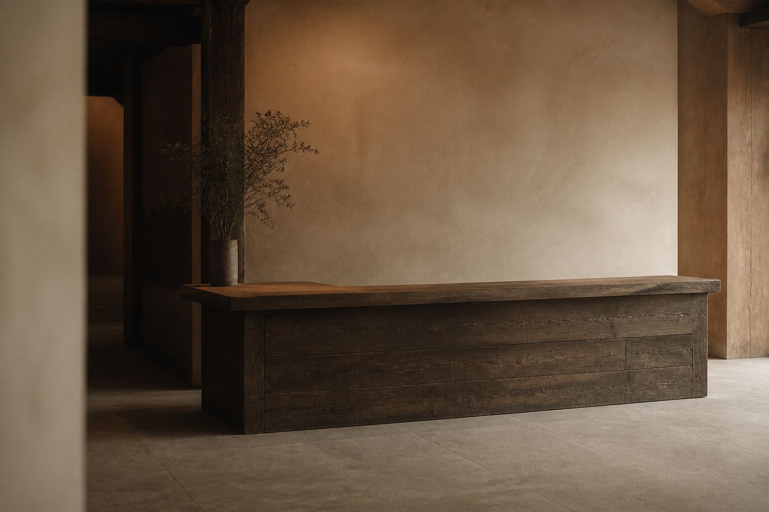 The reception at The Orchid, pale plaster and dark timber
